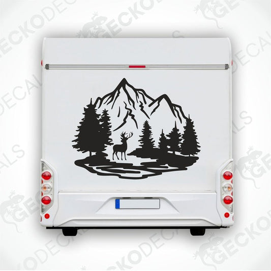 A decal of a mountain with trees and a silhouette of a deer on it.