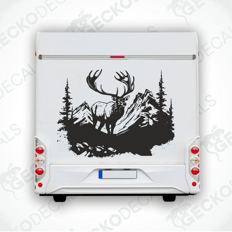 A decal of a deer with a set of antlers, depicted in a mountainous landscape with trees in the background.