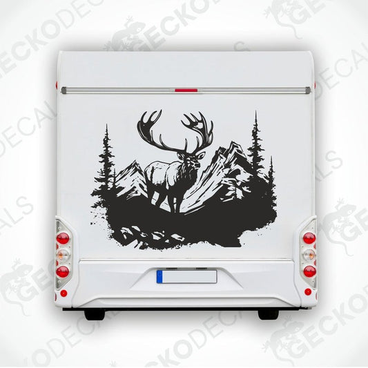 A decal of a deer with a set of antlers, depicted in a mountainous landscape with trees in the background.