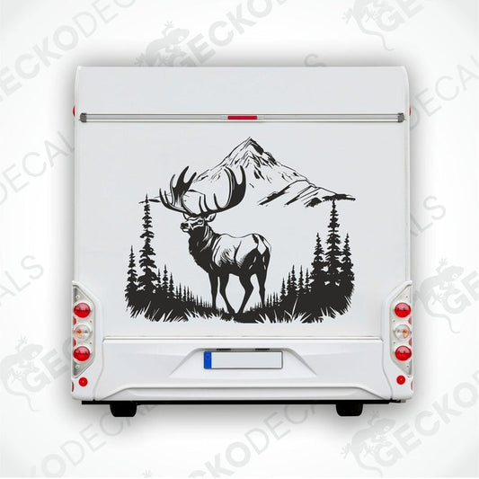 A decal of a deer in a mountainous landscape, positioned on the side of a white vehicle.