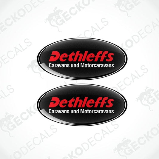Two black, red, and white oval-shaped vinyl decals with the Dethleffs brand logo and text 'Caravans und Motorcaravans'.