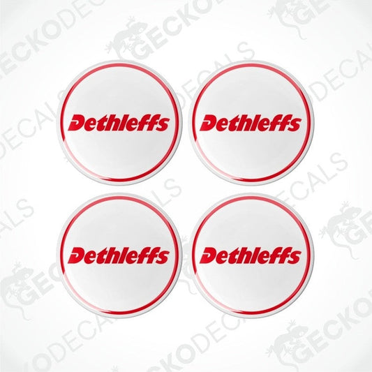 A set of four white, red, and black colored vinyl decals with the Dethleffs brand logo.