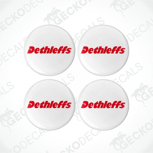 A set of four white, red, and black colored vinyl decals with the Dethleffs brand logo.