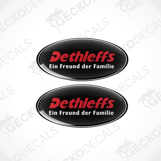 Two oval black vinyl decals with red text 'Dethleffs Ein Freund der Familie' on a white background.