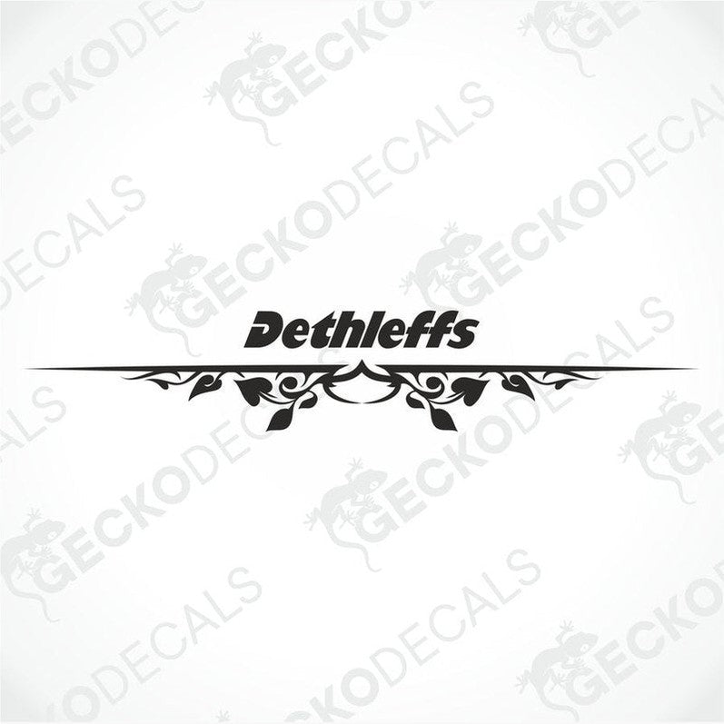 A white Dethleffs caravan with a red and black logo decal on the rear side.