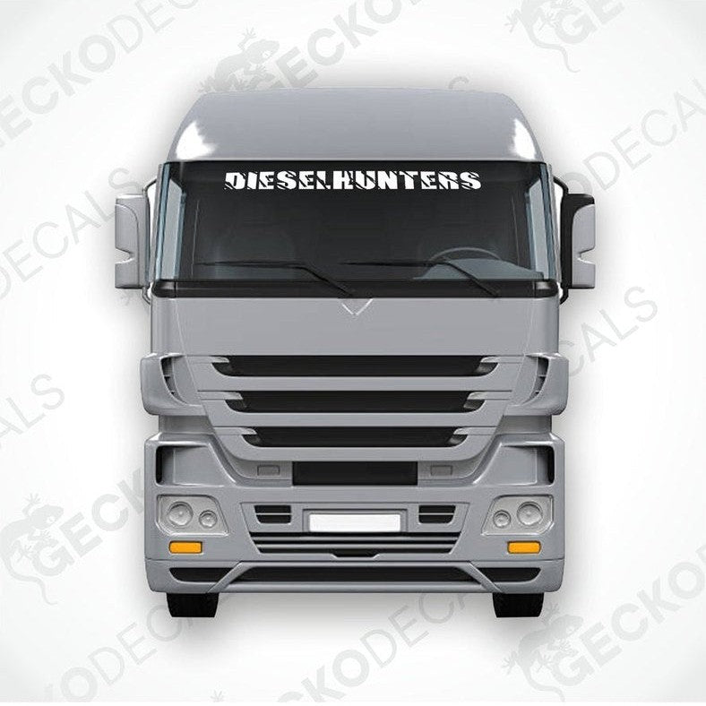A gray truck with a 'DIESELHUNTERS' decal on its windscreen.