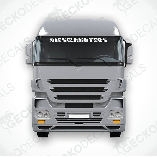 A gray truck with a 'DIESELHUNTERS' decal on its windscreen.