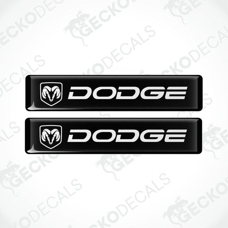 Two black vinyl decals with the Dodge logo in white.