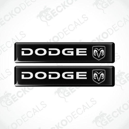 Two black vinyl decals with the Dodge brand logo in white.