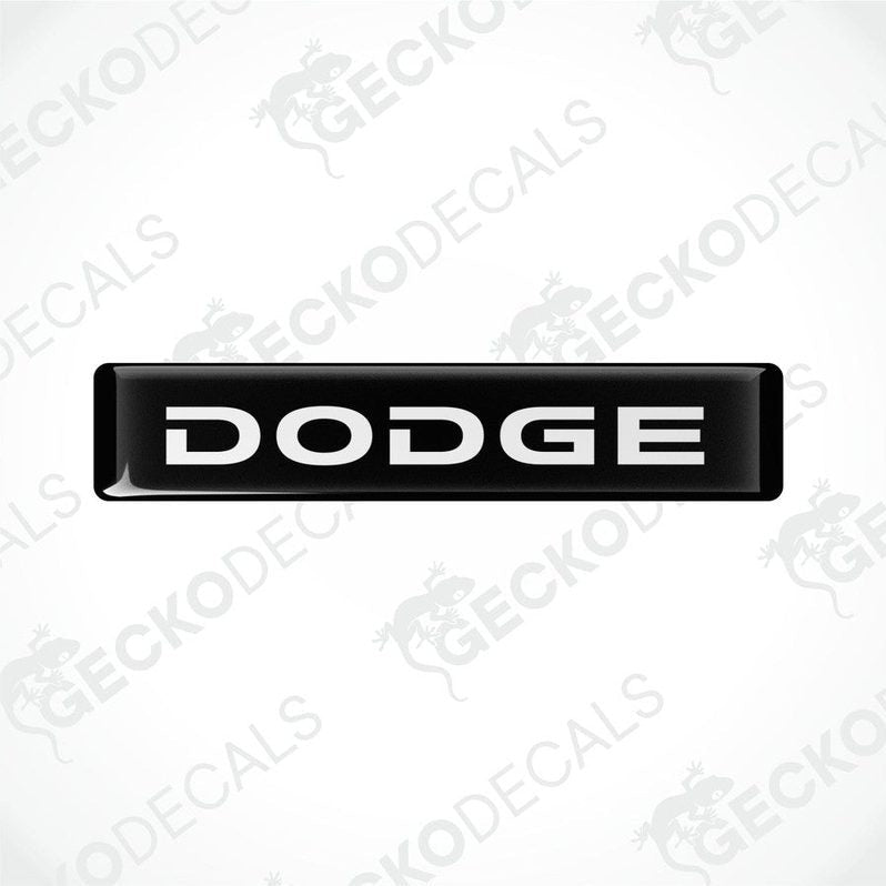 Black and white vinyl decals with the word 'DODGE' printed on them.