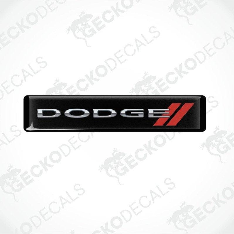 Black vinyl stickers with the word 'DODGE' and a red and silver logo design on them.