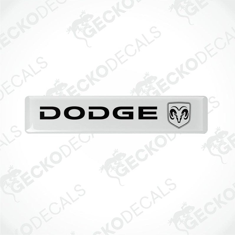  White vinyl decals with the Dodge brand logo in black.