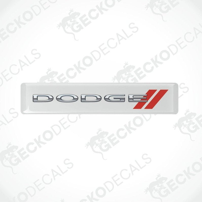White vinyl stickers with the word 'DODGE' and a red and silver logo design on them.