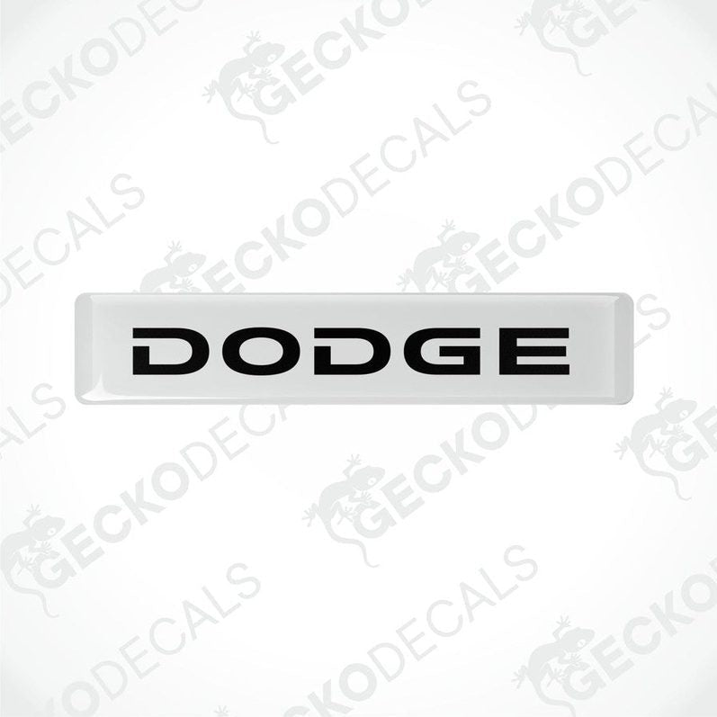White and white vinyl stickers with the word "DODGE" printed in black.