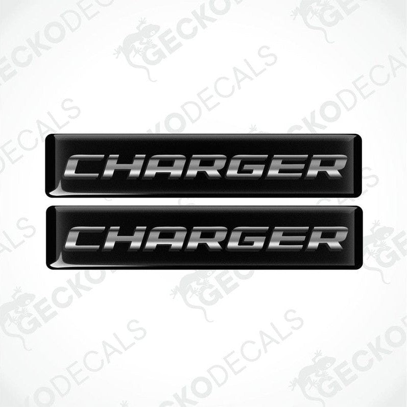 Two black vinyl decals with the word 'CHARGER' written in white letters.