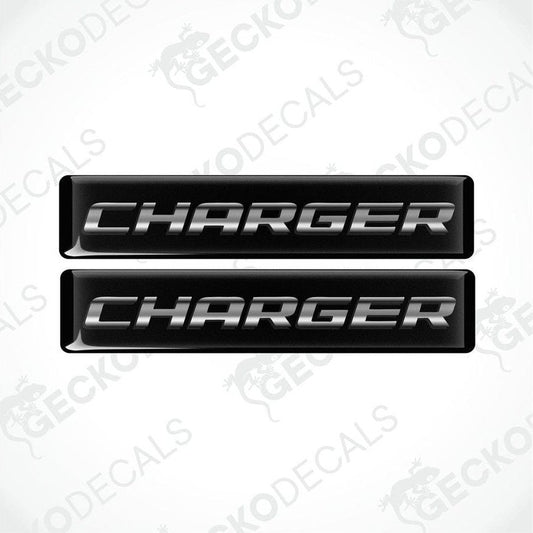 Two black vinyl decals with the word 'CHARGER' written in white letters.