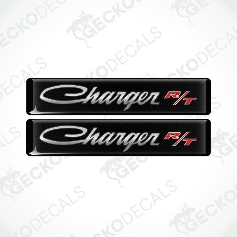 Two black vinyl decals with the text 'Charger R/T' on them, intended for use as car stickers.