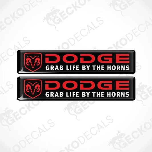 Two black, red, and white vinyl decals with the text 'DODGE' and 'GRAB LIFE BY THE HORNS' on them.