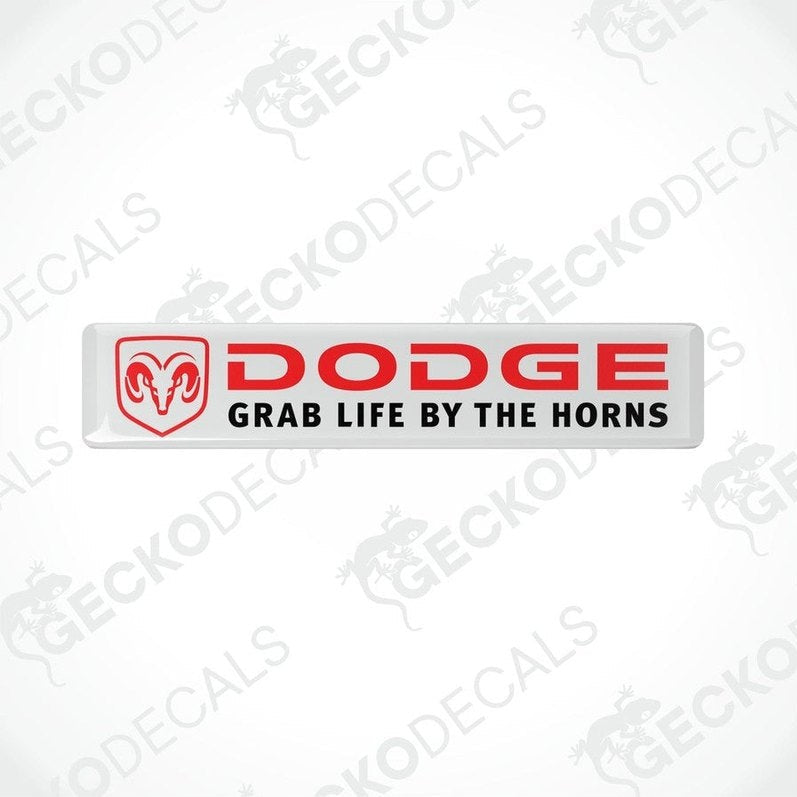 White, red, and black vinyl decals with the text 'DODGE' and 'GRAB LIFE BY THE HORNS' on them.