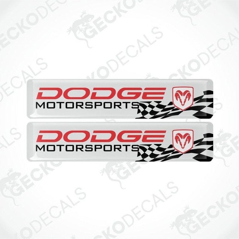 Two white, red, and black vinyl decals with the text 'DODGE Motorsports' and a checkered design.