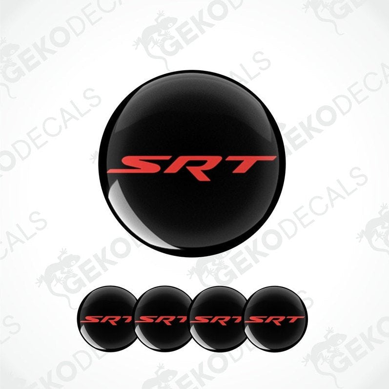 A set of black vinyl decals with red 'SRT' text, including four round decals for vehicle wheels and one larger decal for a vehicle's hood or bumper.