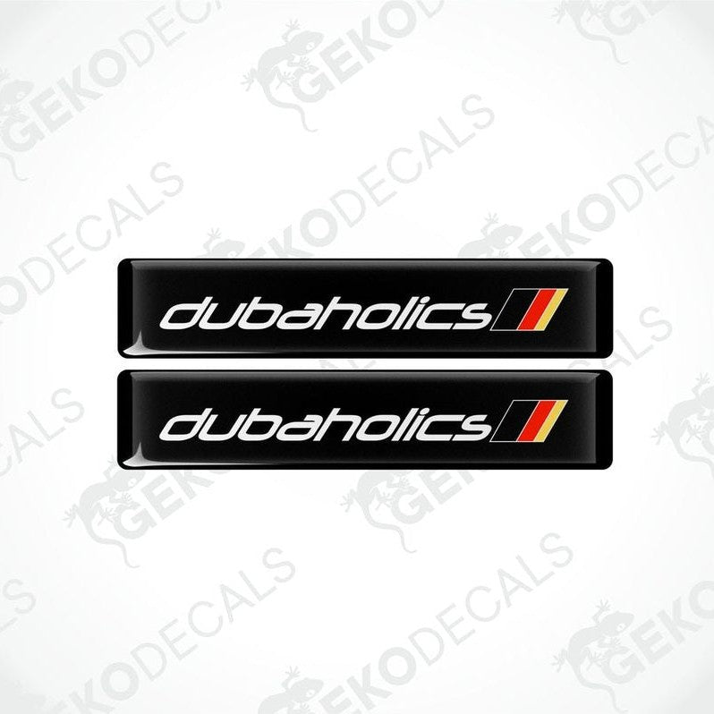 Two black decals with red and withe text that reads 'DUBAHOLICS'