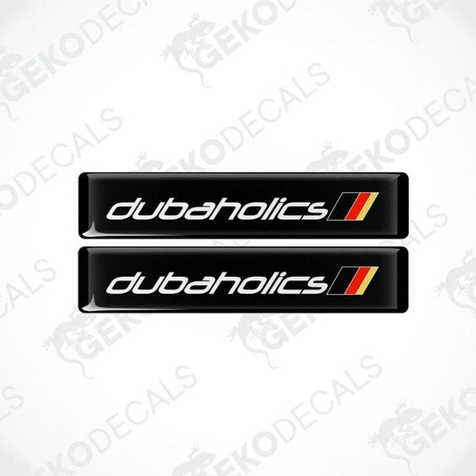 Two black decals with red and withe text that reads 'DUBAHOLICS'