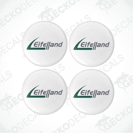 A set of four round white vinyl decals with the Eiffelland logo in green.