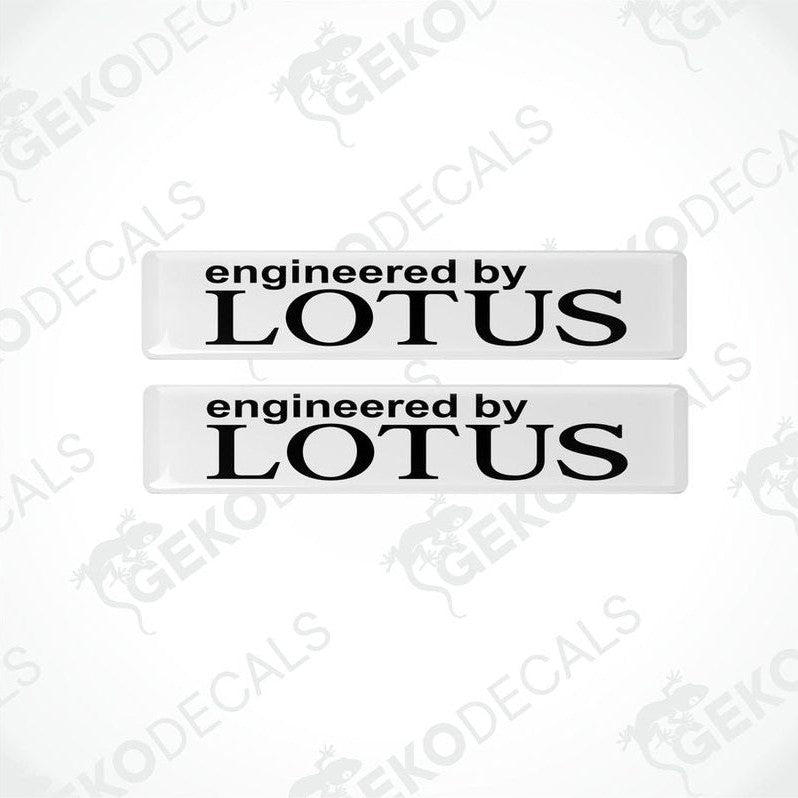 Two white vinyl stickers with the text 'ENGINEERED BY LOTUS' in black.