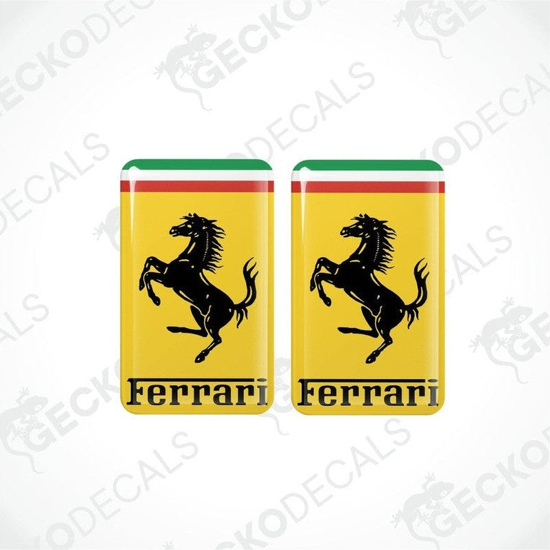 A set of two multicolored vinyl stickers with a Ferrari logo on a white background.