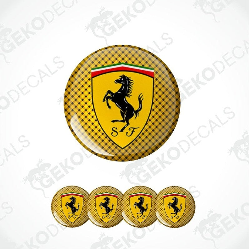 A set of yellow vinyl decals with the Ferrari logo, including one large emblem and four smaller ones.
