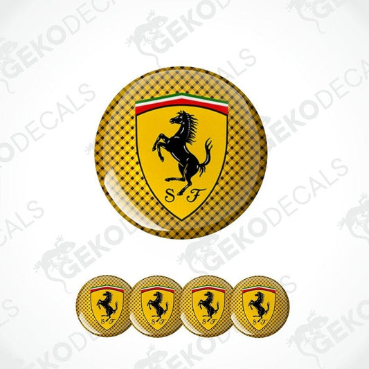 A set of yellow vinyl decals with the Ferrari logo, including one large emblem and four smaller ones.