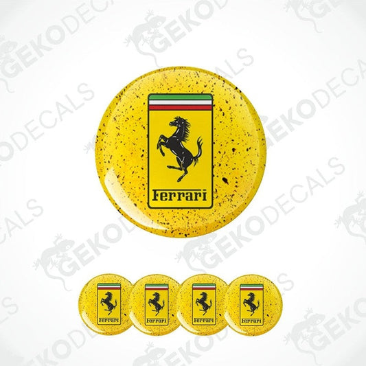 A set of four yellow vinyl stickers with the Ferrari logo on them.