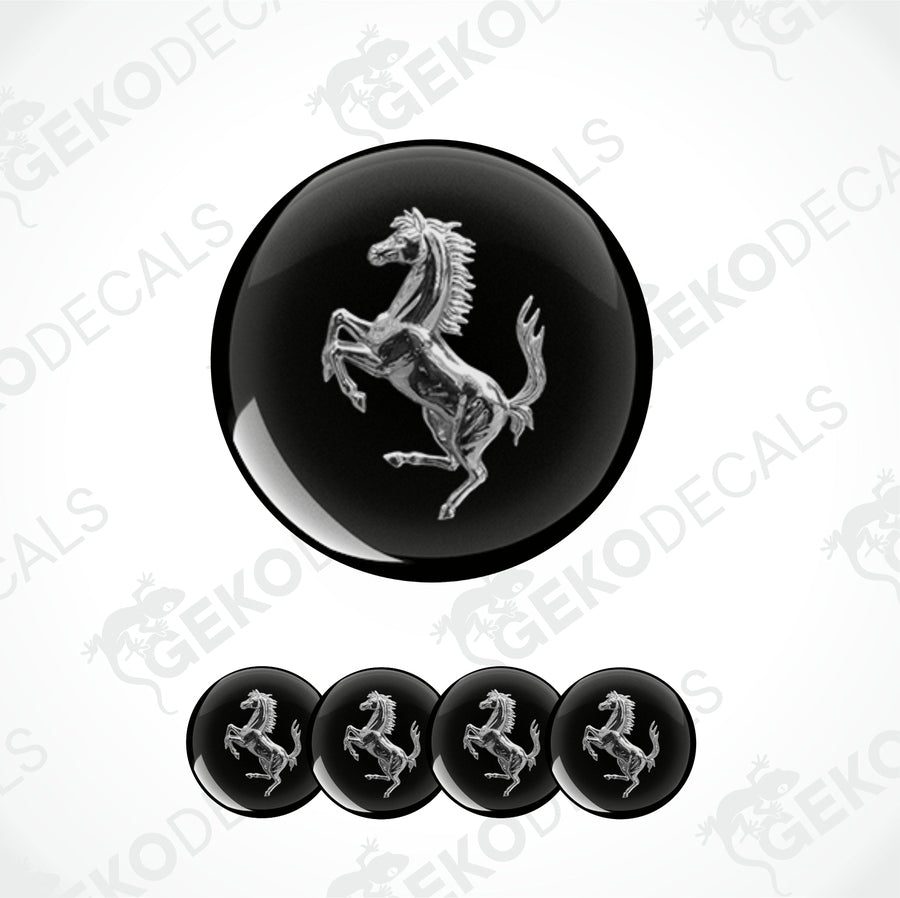 A set of four black vinyl stickers with a silver Ferrari horse logo design.