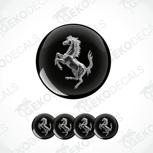 A set of four black vinyl stickers with a silver Ferrari horse logo design.