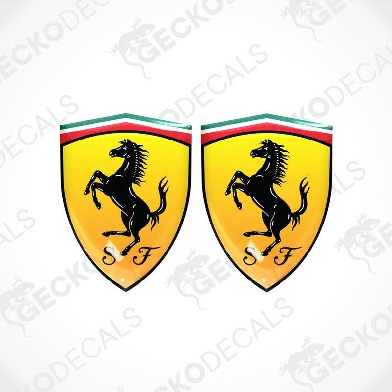 Two yellow car decals with a black horse silhouette and the letter 'F' on a shield shape with red and green stripes at the top.