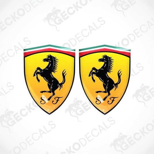Two yellow car decals with a black horse silhouette and the letter 'F' on a shield shape with red and green stripes at the top.