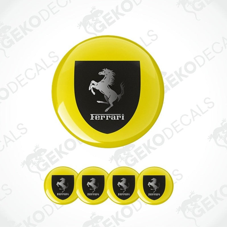 A set of vinyl decals with a polyurethane coating, featuring the Ferrari logo in black on a yellow background. The set includes four decals of different sizes.
