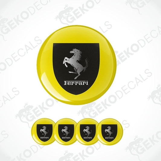 A set of vinyl decals with a polyurethane coating, featuring the Ferrari logo in black on a yellow background. The set includes four decals of different sizes.