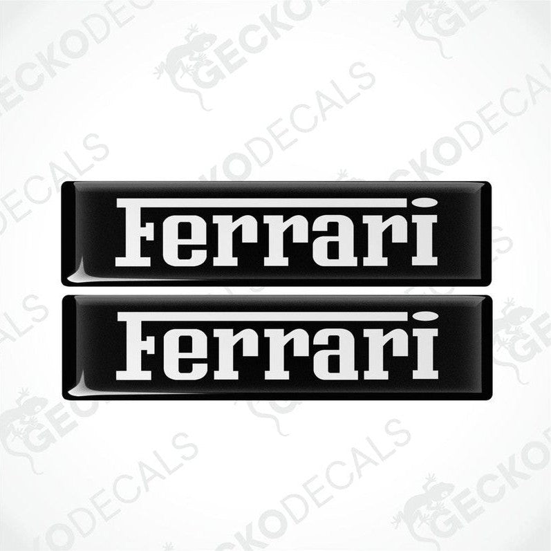 Two black vinyl stickers with the FERRARI logo in white text.