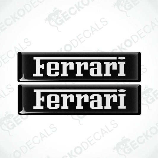 Two black vinyl stickers with the FERRARI logo in white text.