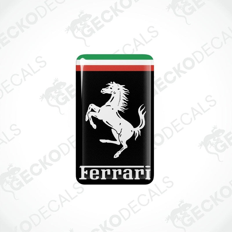 Vinyl stickers with a depiction of a horse and the Ferrari logo on a black background with red and green stripes.