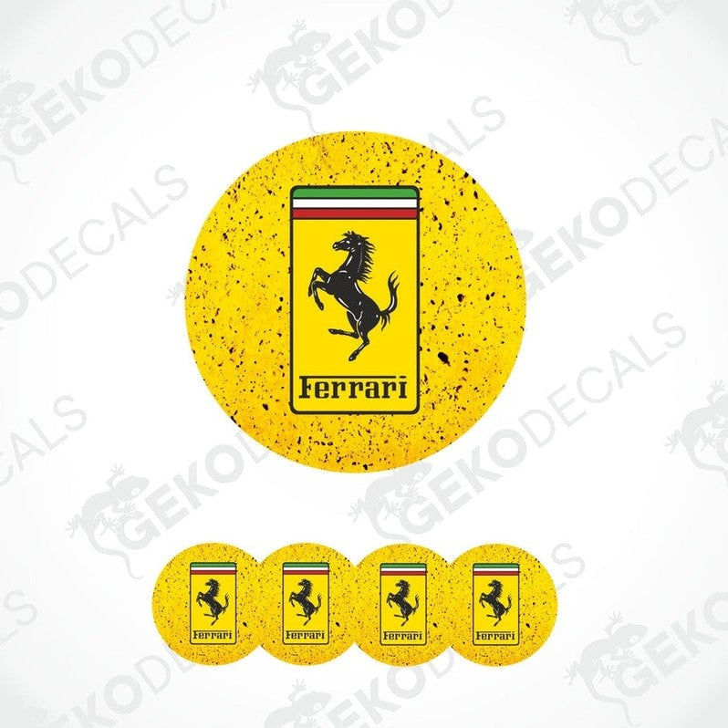 A set of four yellow vinyl stickers with the Ferrari logo on them.