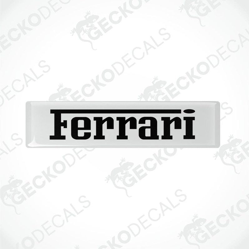 Withe vinyl stickers with the FERRARI logo in black text.