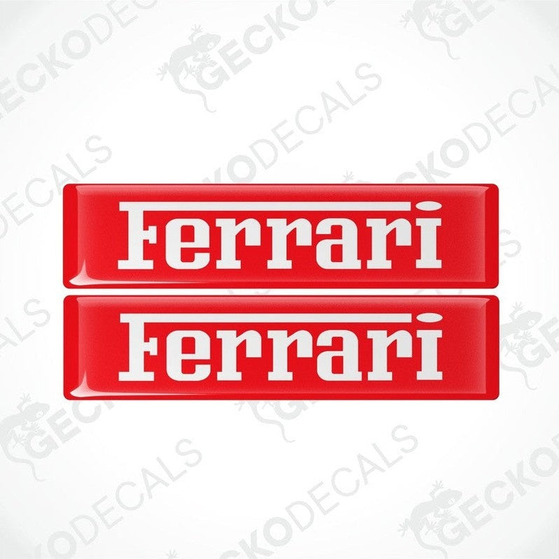 Two red vinyl stickers with the FERRARI logo in white text.