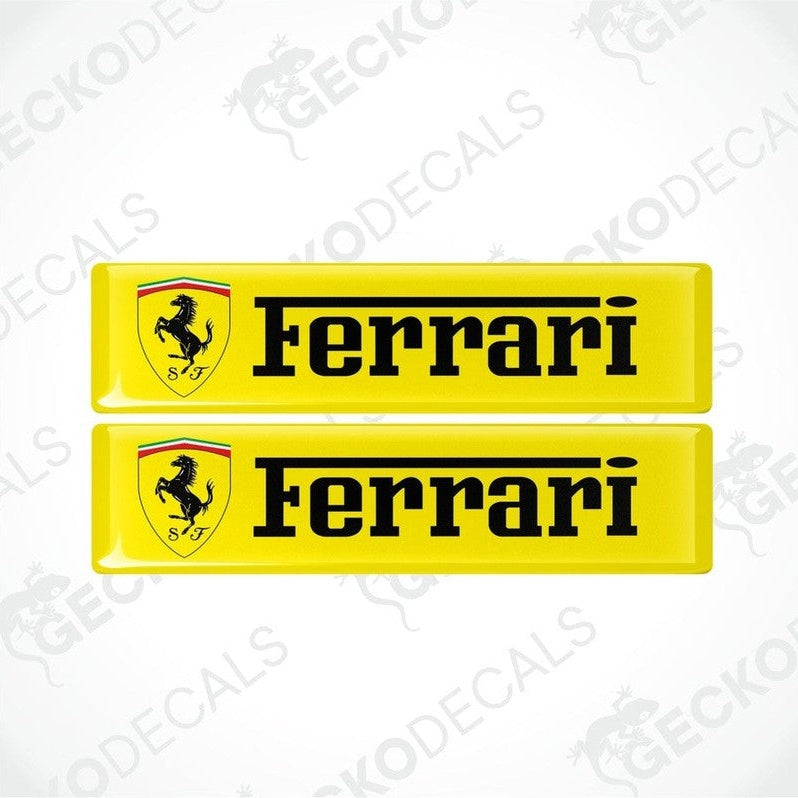 Two rectangular yellow vinyl decals with the Ferrari logo and the text 'Ferrari ' on a yellow background.