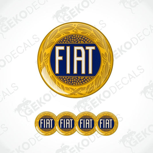 A set of four gold, blue, and white vinyl stickers with the word 'FIAT' in the center, featuring a geometric pattern around the border.