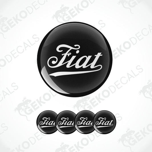 Set of black vinyl decals with the white 'Fiat' logo, including one large round decal and four smaller ones shaped like hubcaps.