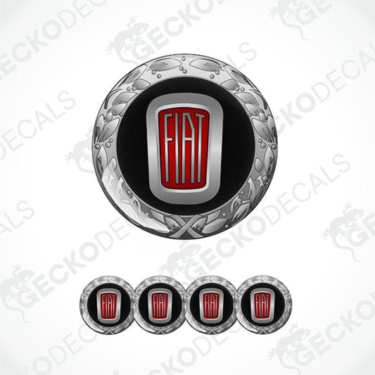 A set of vinyl decals with a polyurethane coating, featuring a central round decal with a Fiat logo and ornate designs, flanked by four additional rectangular decals.