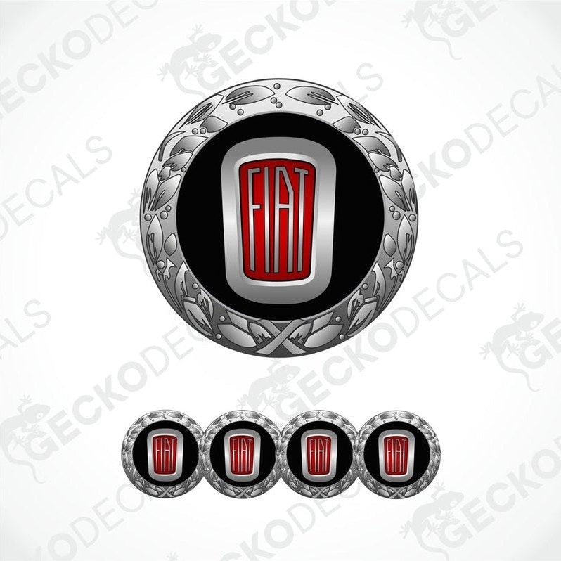 A set of vinyl decals with a polyurethane coating, featuring a central round decal with a Fiat logo and ornate designs, flanked by four additional rectangular decals.